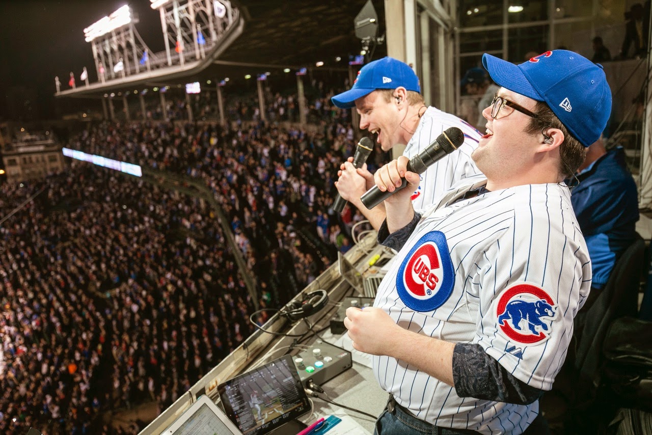 THE BOOK OF MORMON STARS VISIT WRIGLEY FIELD 1 THE BOOK OF MORMON stars David Larsen (Elder Price) and Cody Jamison Strand (Elder Cunningham) appeared at Wrigley Field on April 13th performing the National Anthem, Delivering the Ceremonial First Pitch and Leading the Seventh Inning Stretch as the Cubs battled the Cincinnati Reds.  Photo Credit: Steve Green Photography. 